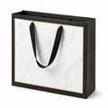 Borsa regalo 35 x 12 x 28 cm in carta nera bianca e oro con manici in nastro stile marmo