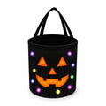 Borsa porta dolci cilindrica 25 x 25 cm in poliestere nero con zucca luminosa
